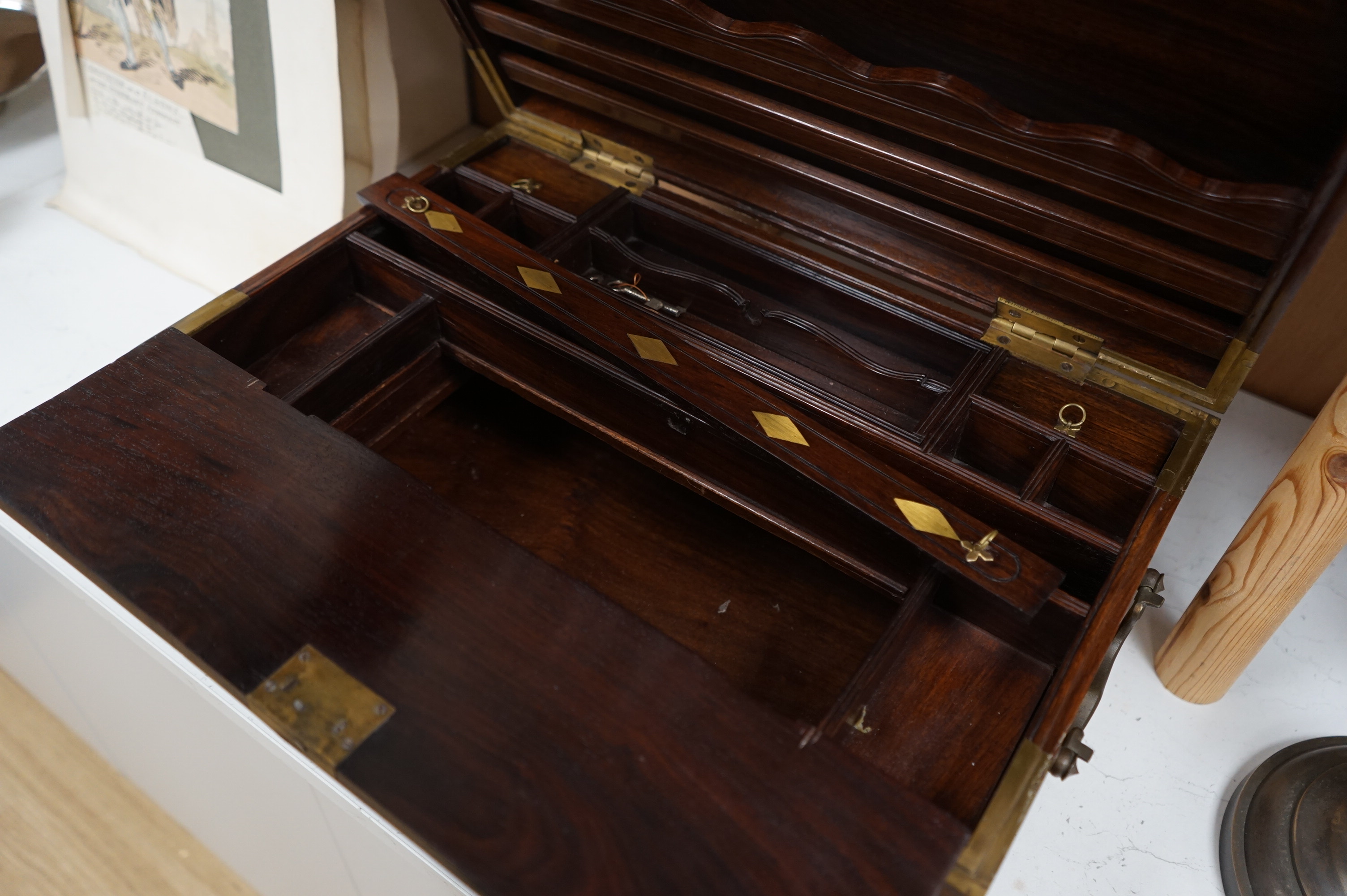 A 1920’s Anglo Indian brass mounted rosewood chest with fitted interior and key, 48cm wide. Condition - fair/good